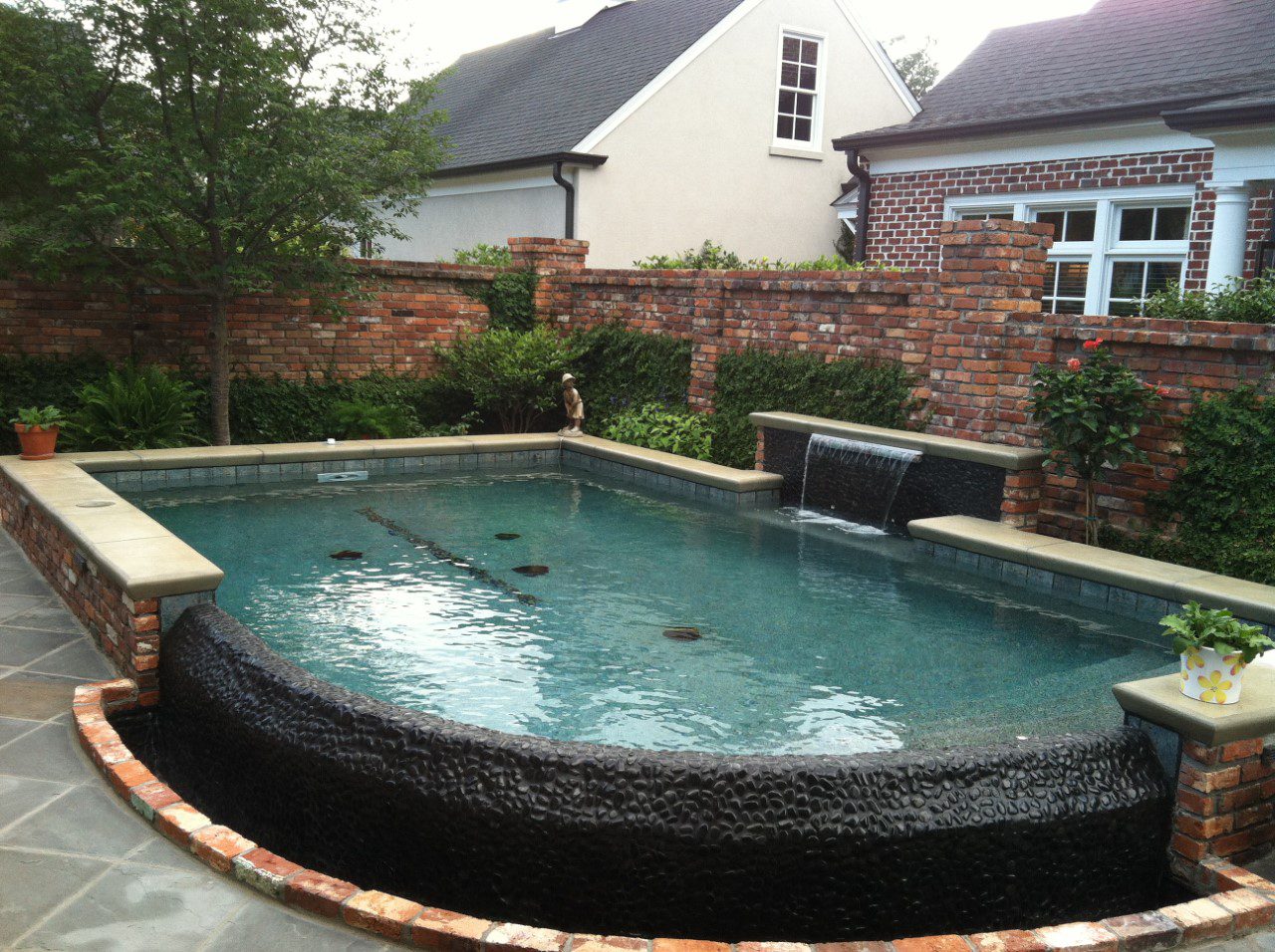 A pot of plant near the pool